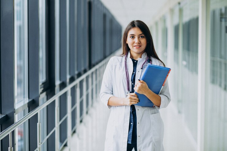 attractive female doctor standing with documents hospital_1303 20688